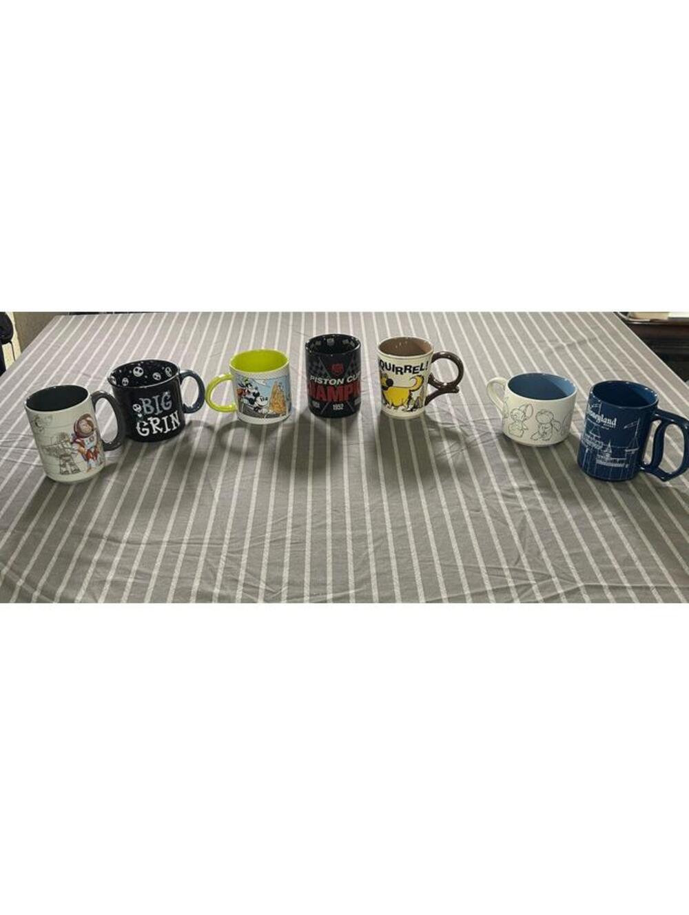 various collectible mugs featuring characters from Disney lot of 7